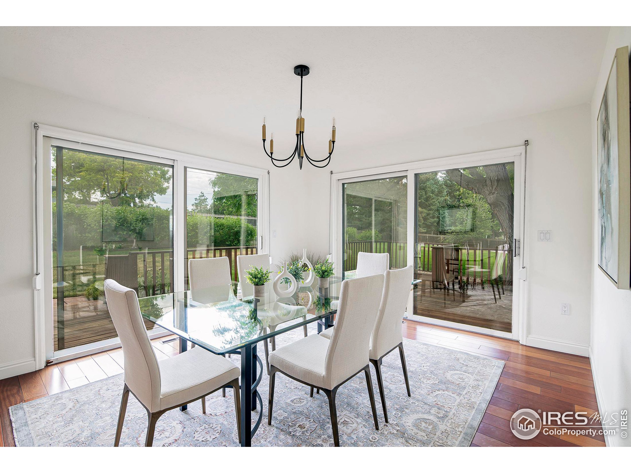 7700 O Connor Road Boulder, CO 80303 - Photo 6 of 40 a dining room with furniture wooden floor and a rug