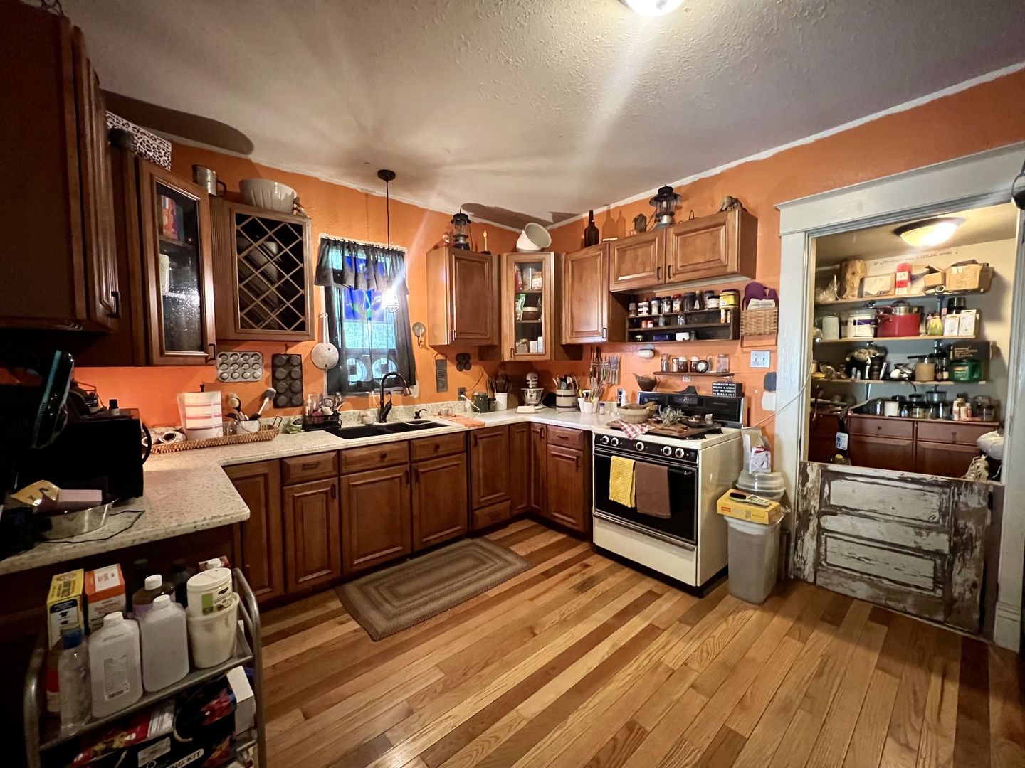 207 2nd Street Broadlands, IL 61816 - Photo 11 of 45 a kitchen with stainless steel appliances granite countertop a stove a sink and a refrigerator