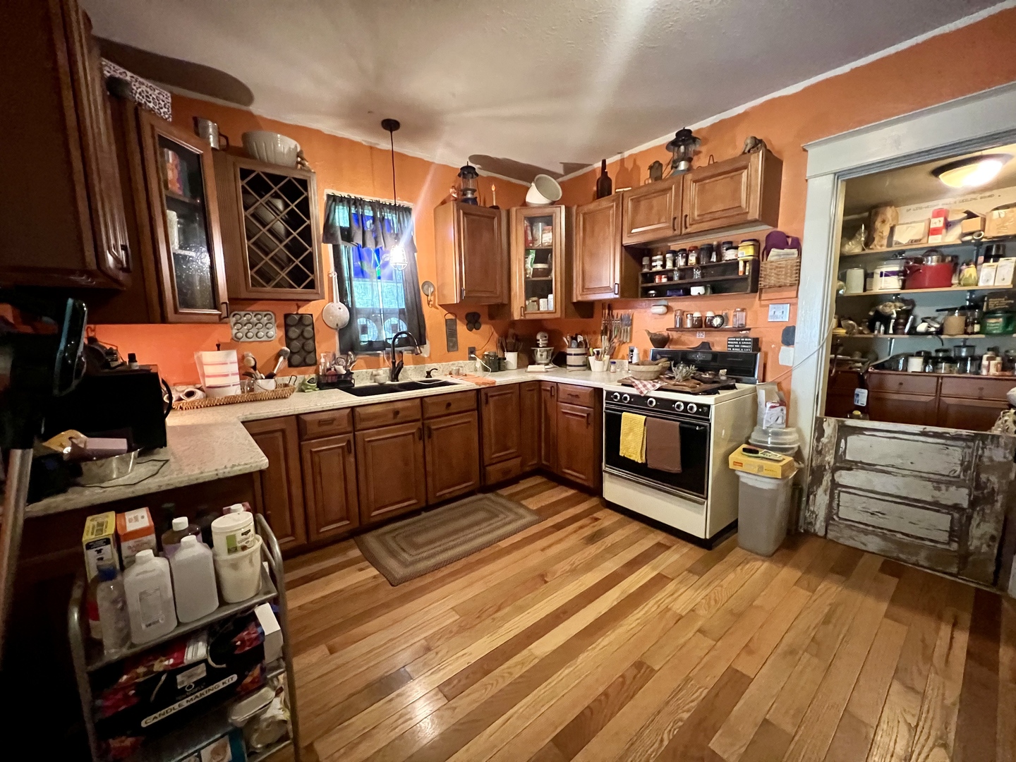 207 2nd Street Broadlands, IL 61816 - Photo 12 of 45 a kitchen with stainless steel appliances a stove a sink and a refrigerator