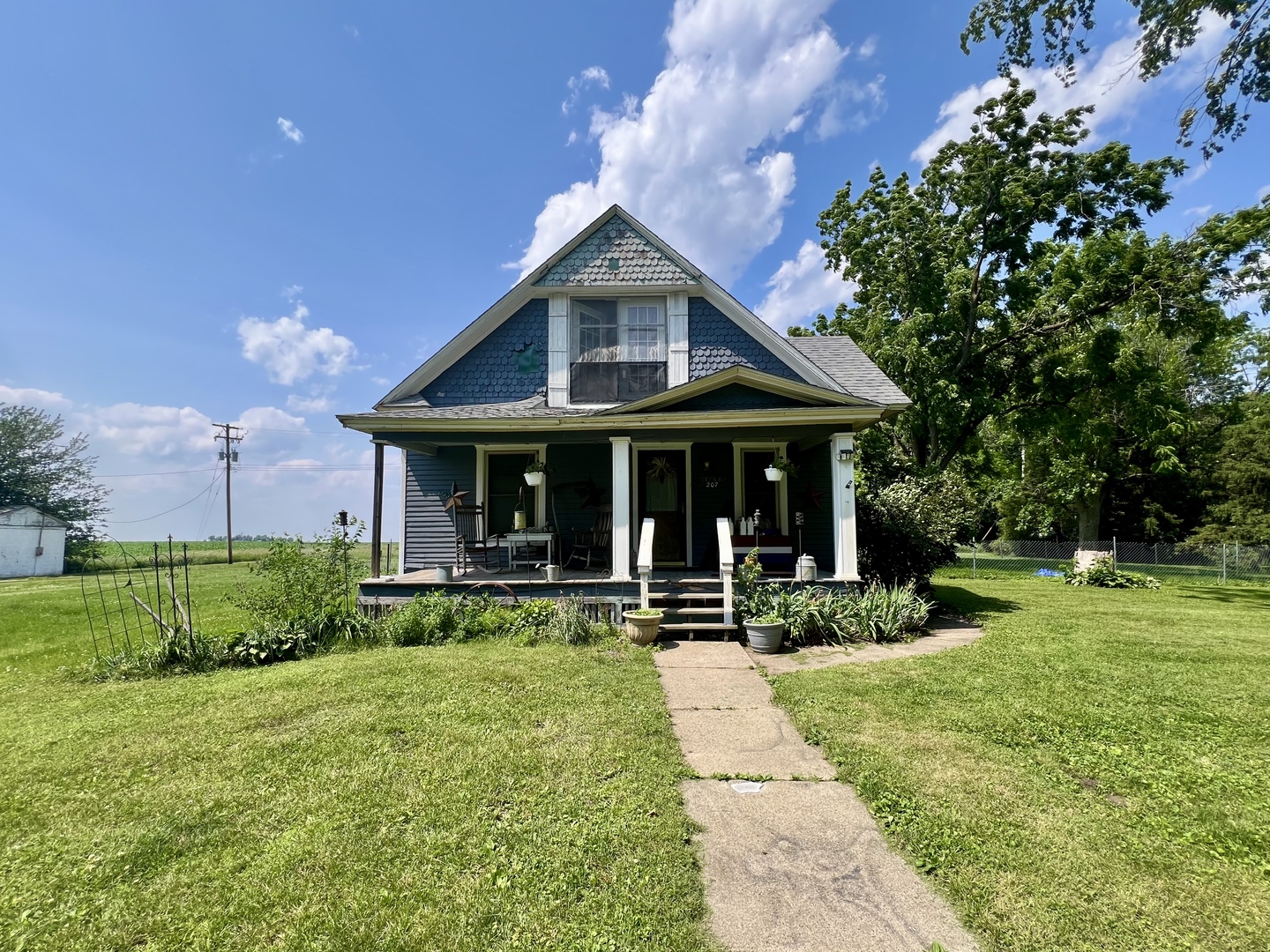 207 2nd Street Broadlands, IL 61816 - Photo 2 of 45 a front view of house with yard and green space