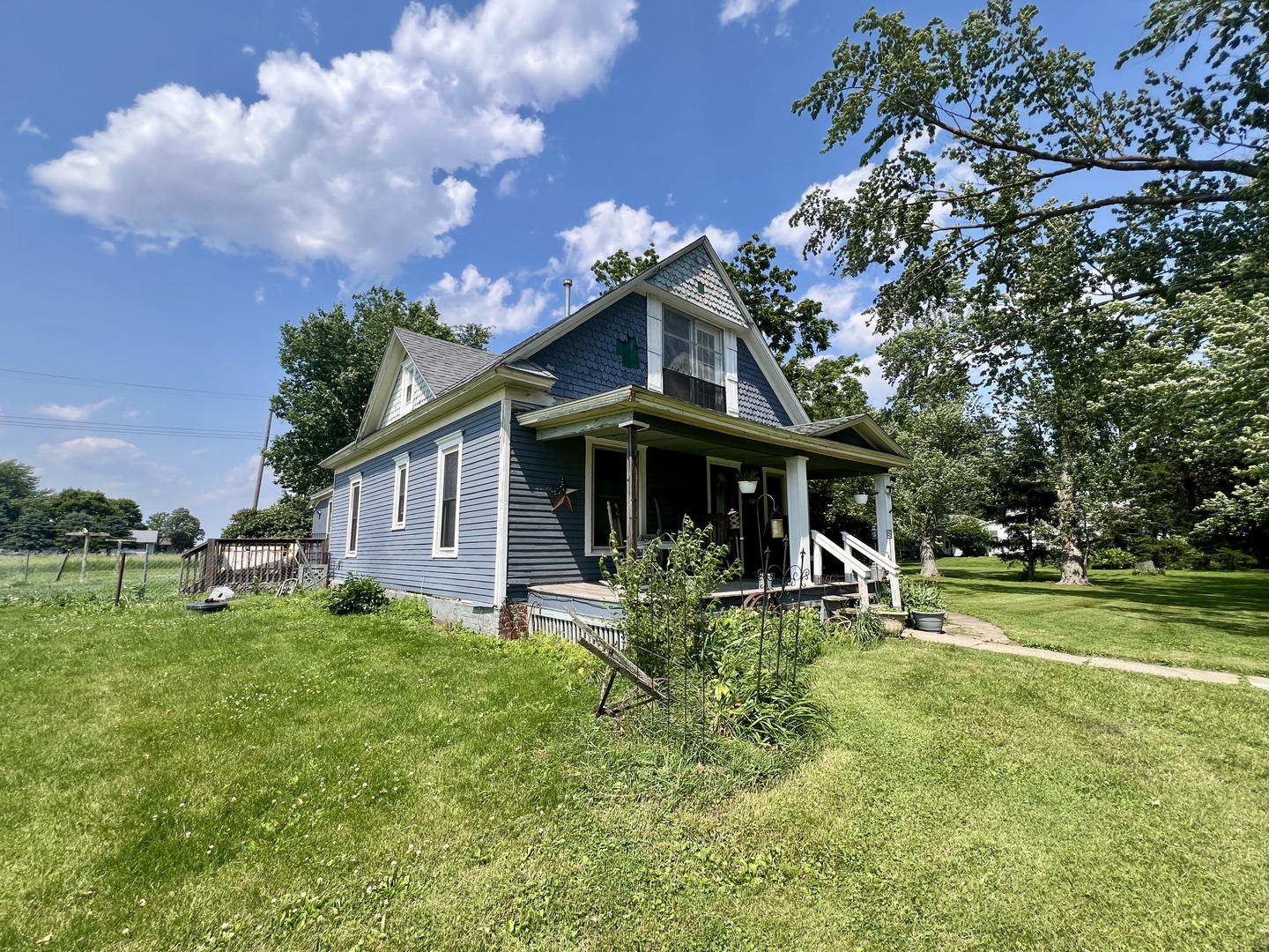 207 2nd Street Broadlands, IL 61816 - Photo 3 of 45 a view of a house with backyard and sitting area