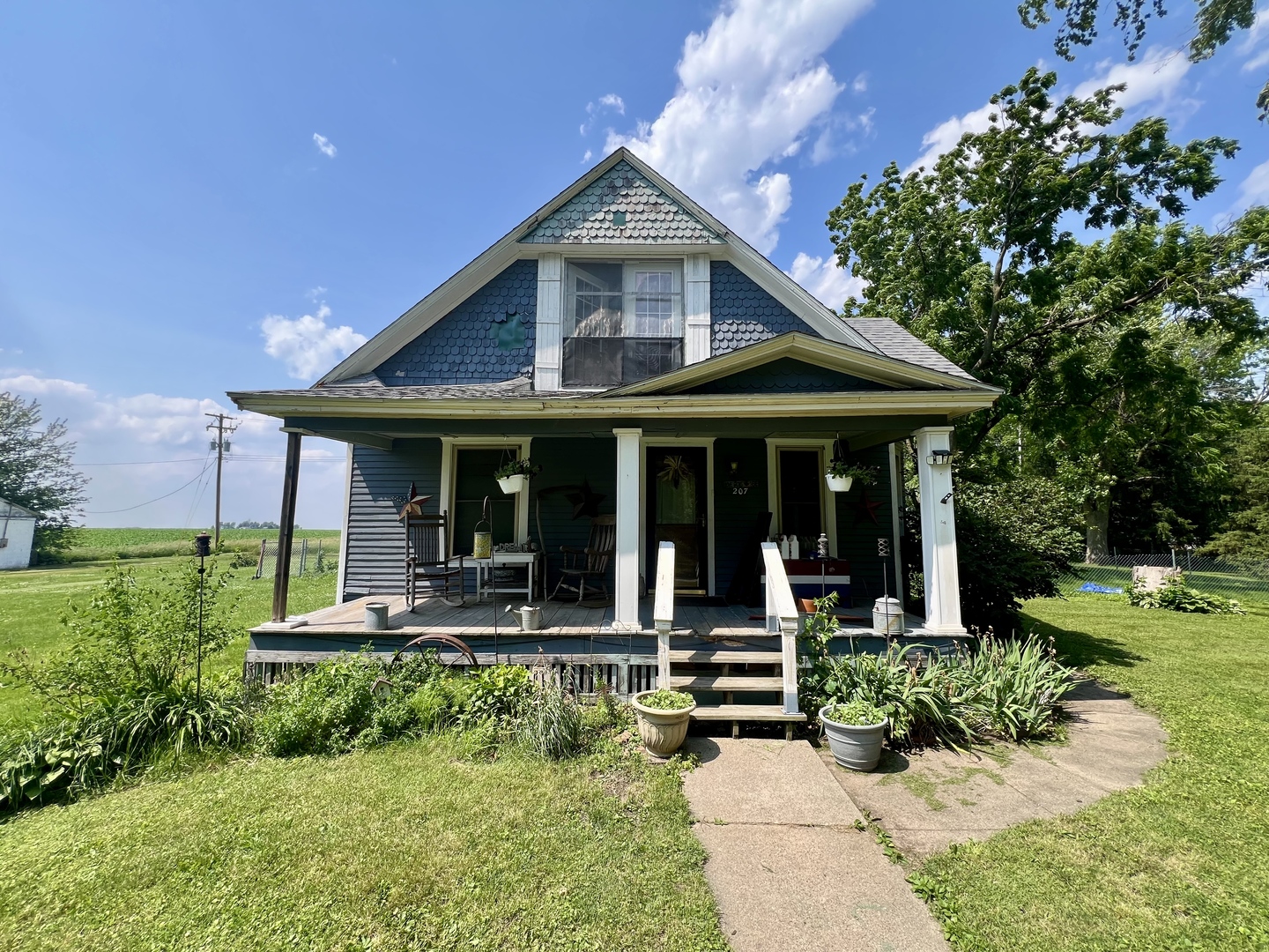 207 2nd Street Broadlands, IL 61816 - Photo 4 of 45 a front view of a house with a yard table and chairs