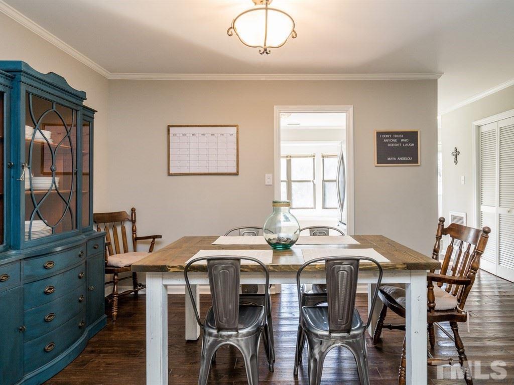 5306 Ridgeloch Place Raleigh, NC 27612 - Photo 8 of 23 a view of a dining room with furniture and window