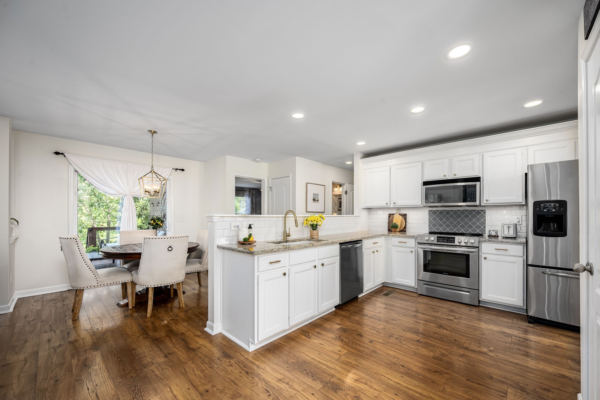 201 Nashua Court Murfreesboro, TN 37128 - Photo 15 of 79 a kitchen with a sink stainless steel appliances and white cabinets