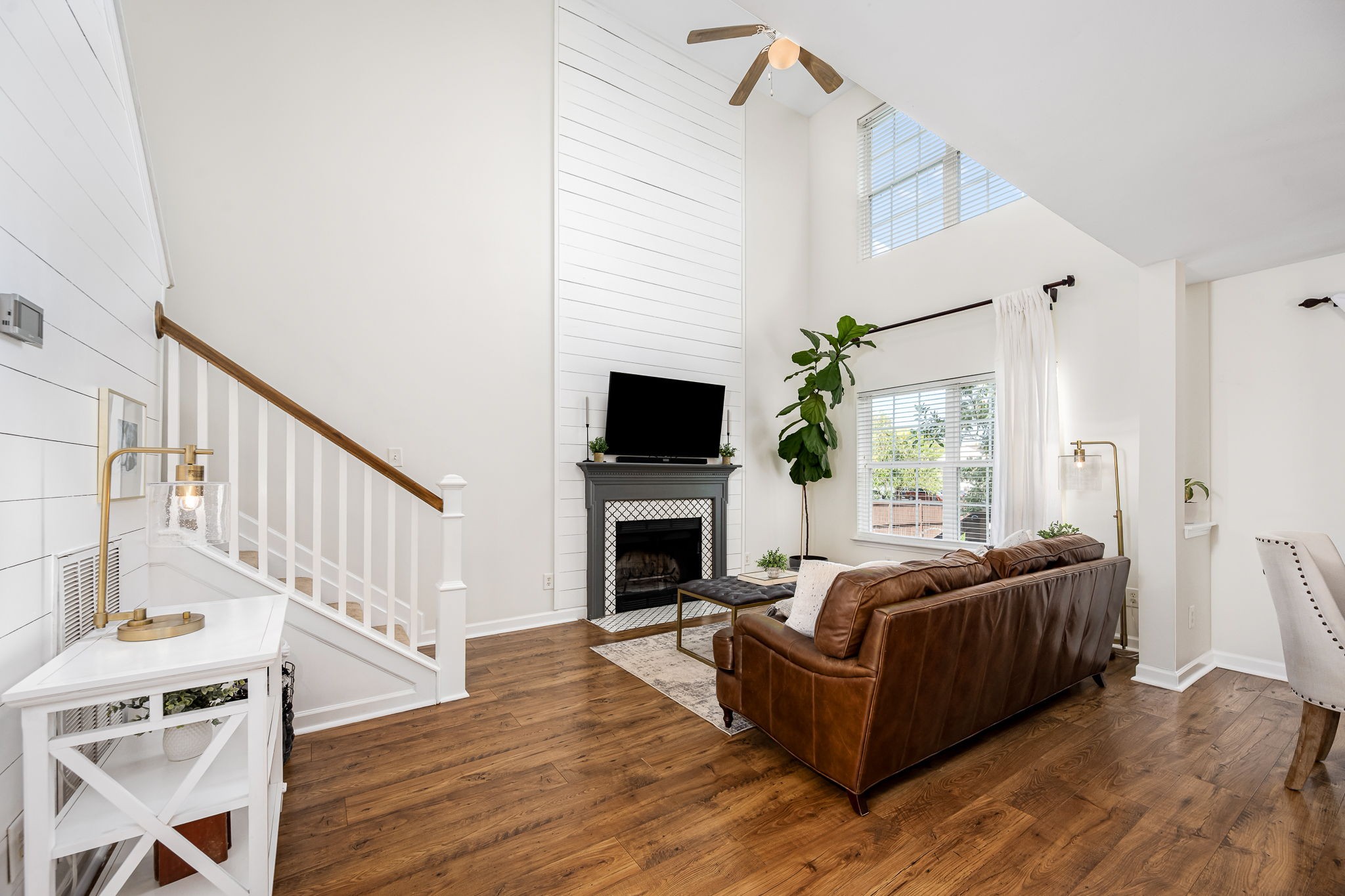 201 Nashua Court Murfreesboro, TN 37128 - Photo 20 of 79 a living room with furniture a fireplace and a flat screen tv