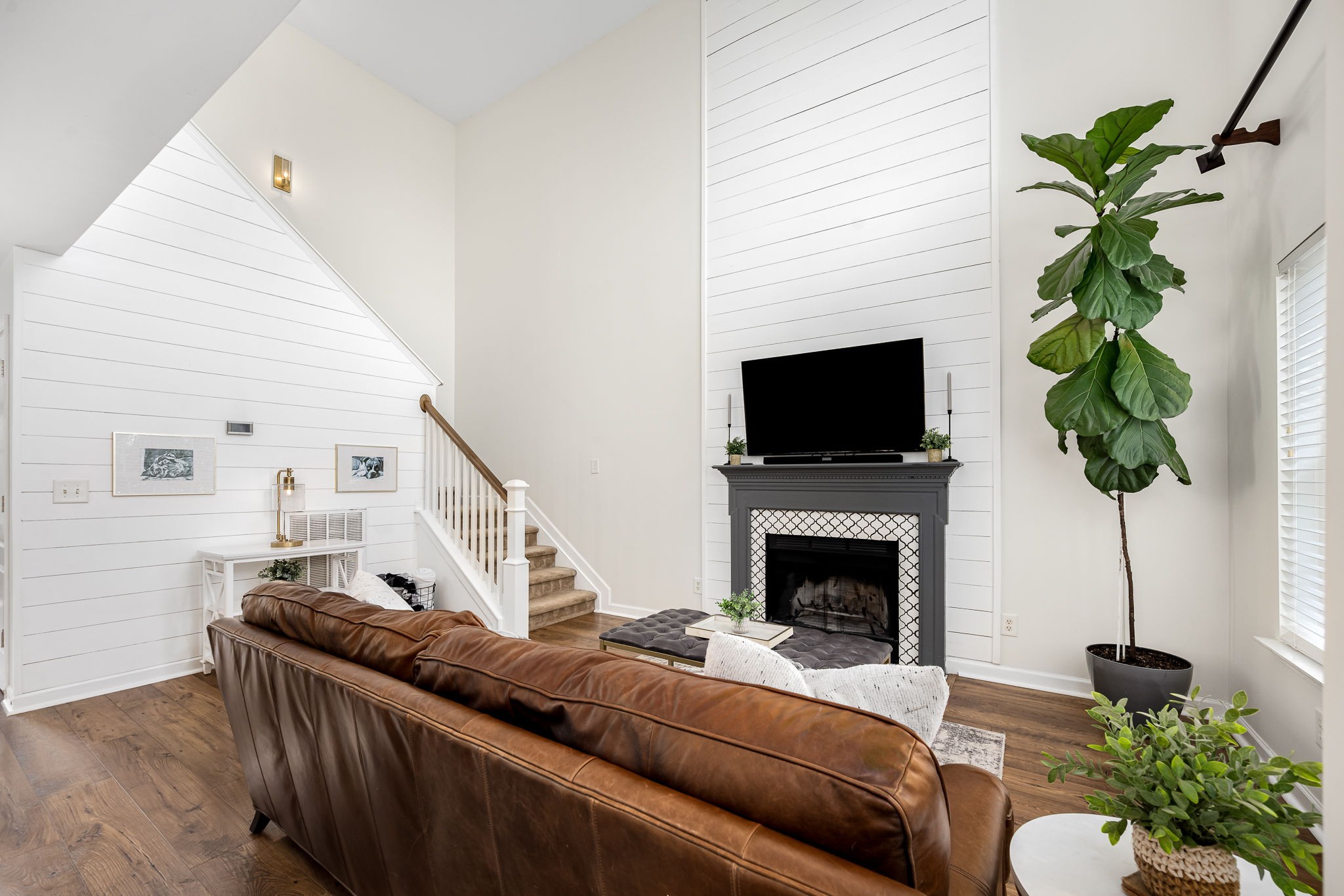 201 Nashua Court Murfreesboro, TN 37128 - Photo 22 of 79 a living room with furniture a fireplace and a potted plant