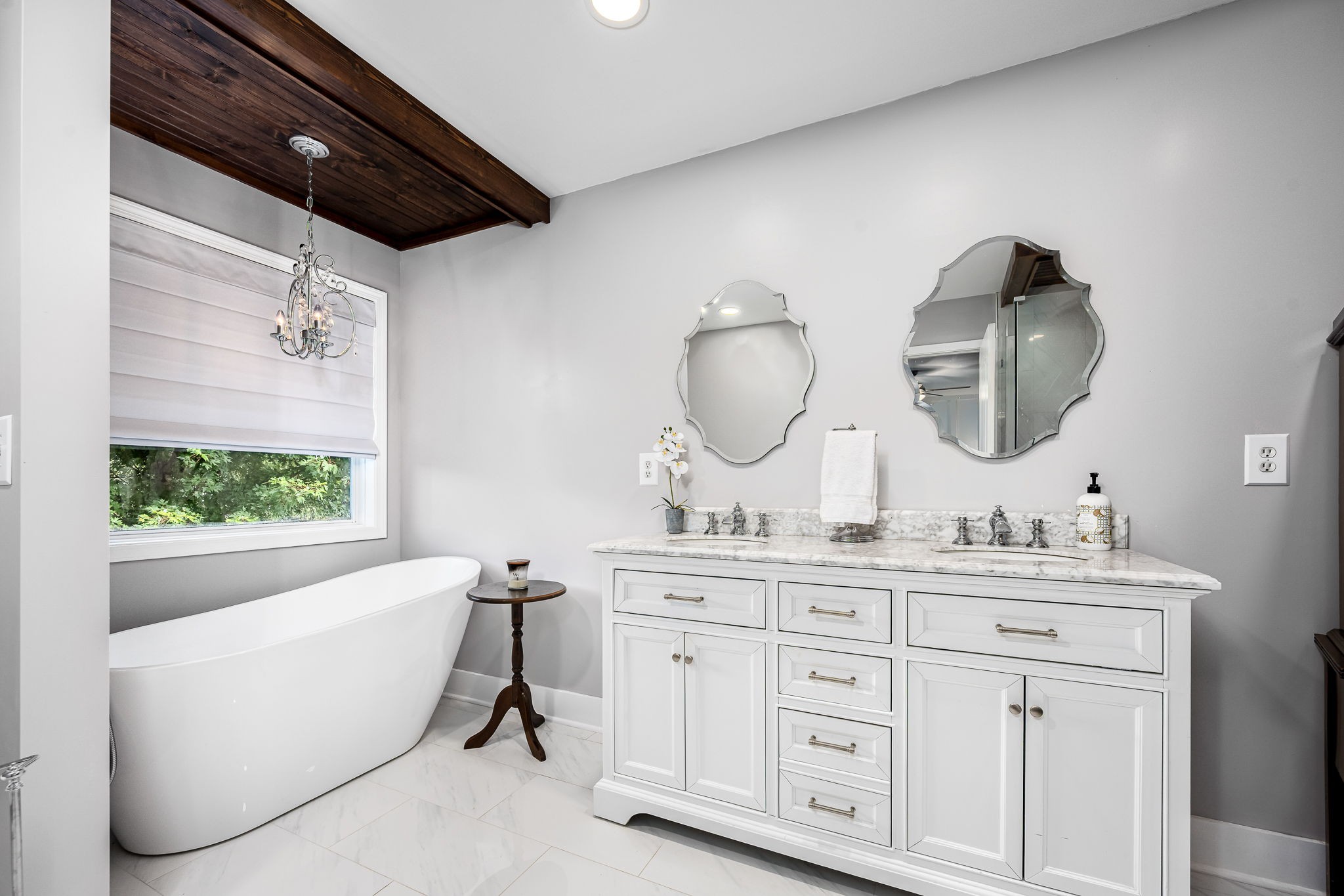 201 Nashua Court Murfreesboro, TN 37128 - Photo 31 of 79 a bathroom with a double vanity sink a mirror and a bathtub