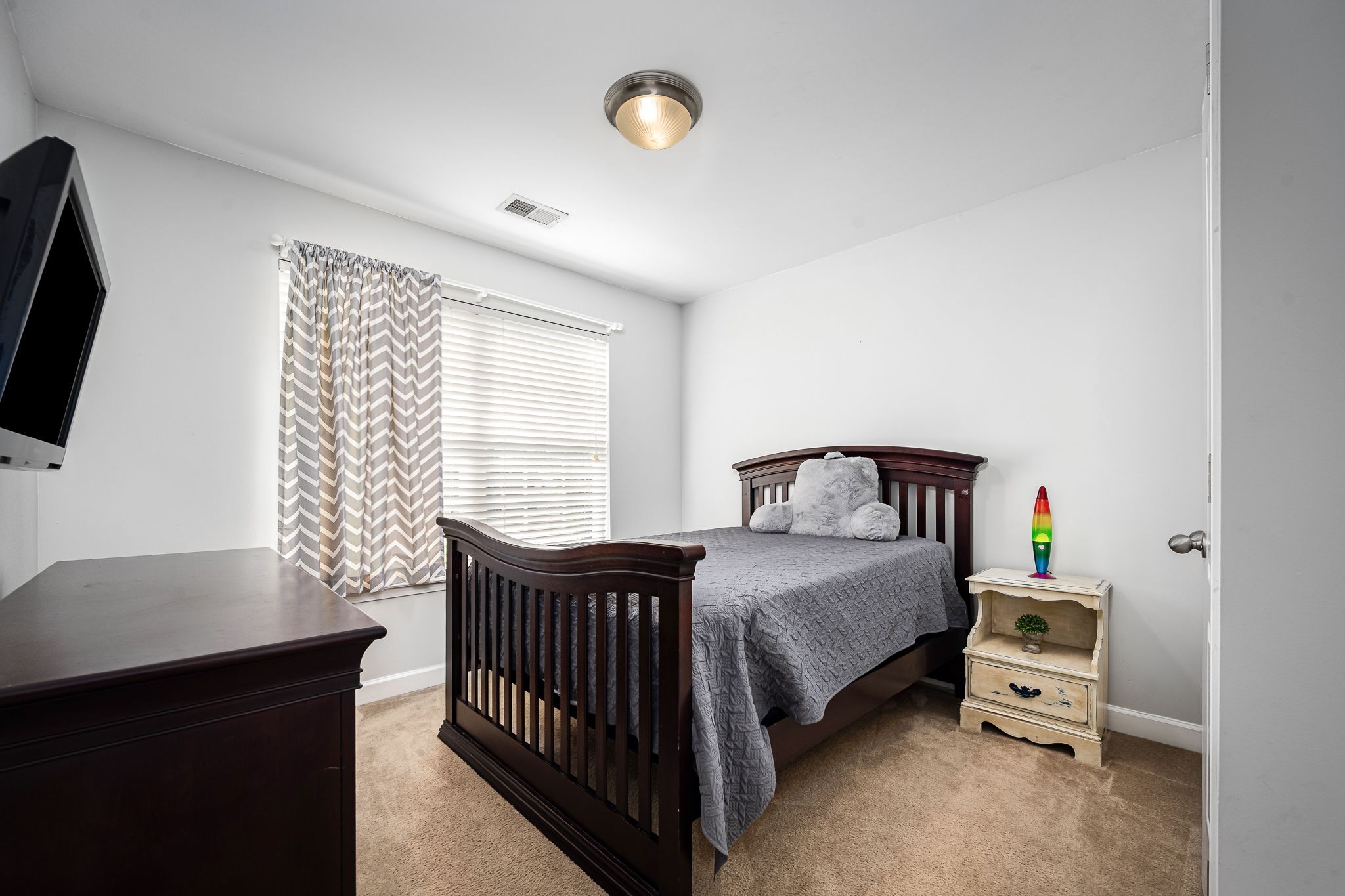 201 Nashua Court Murfreesboro, TN 37128 - Photo 45 of 79 a bedroom with a bed and a tv on the dresser