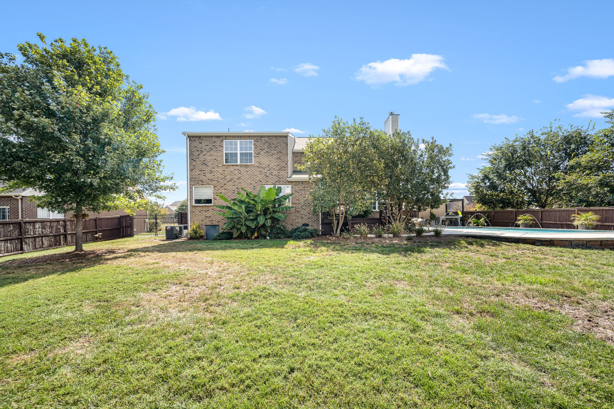 201 Nashua Court Murfreesboro, TN 37128 - Photo 64 of 79 a swimming pool with outdoor seating and yard