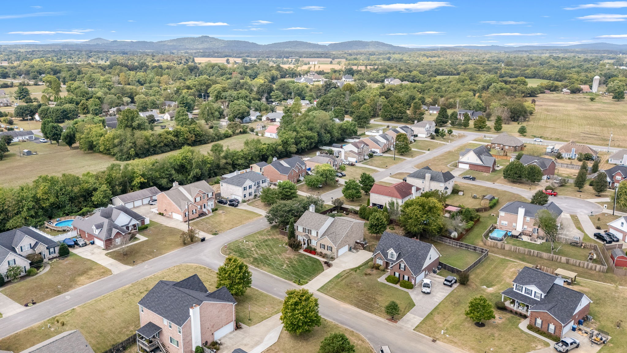 201 Nashua Court Murfreesboro, TN 37128 - Photo 70 of 79 an aerial view of a city with lots of residential buildings and mountain view in back