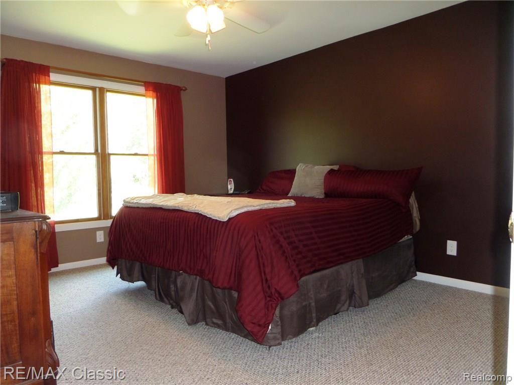 10099 West Coon Lake Road Webberville, MI 48892 - Photo 8 of 15 Master bedroom suite