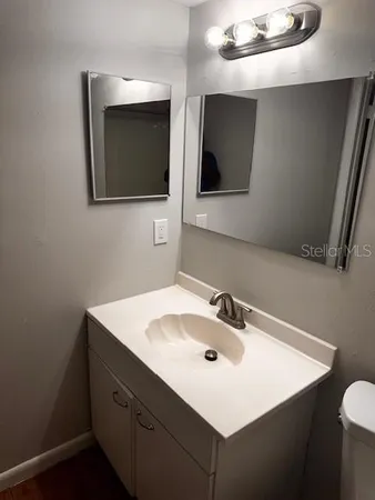 a bathroom with a sink and mirror
