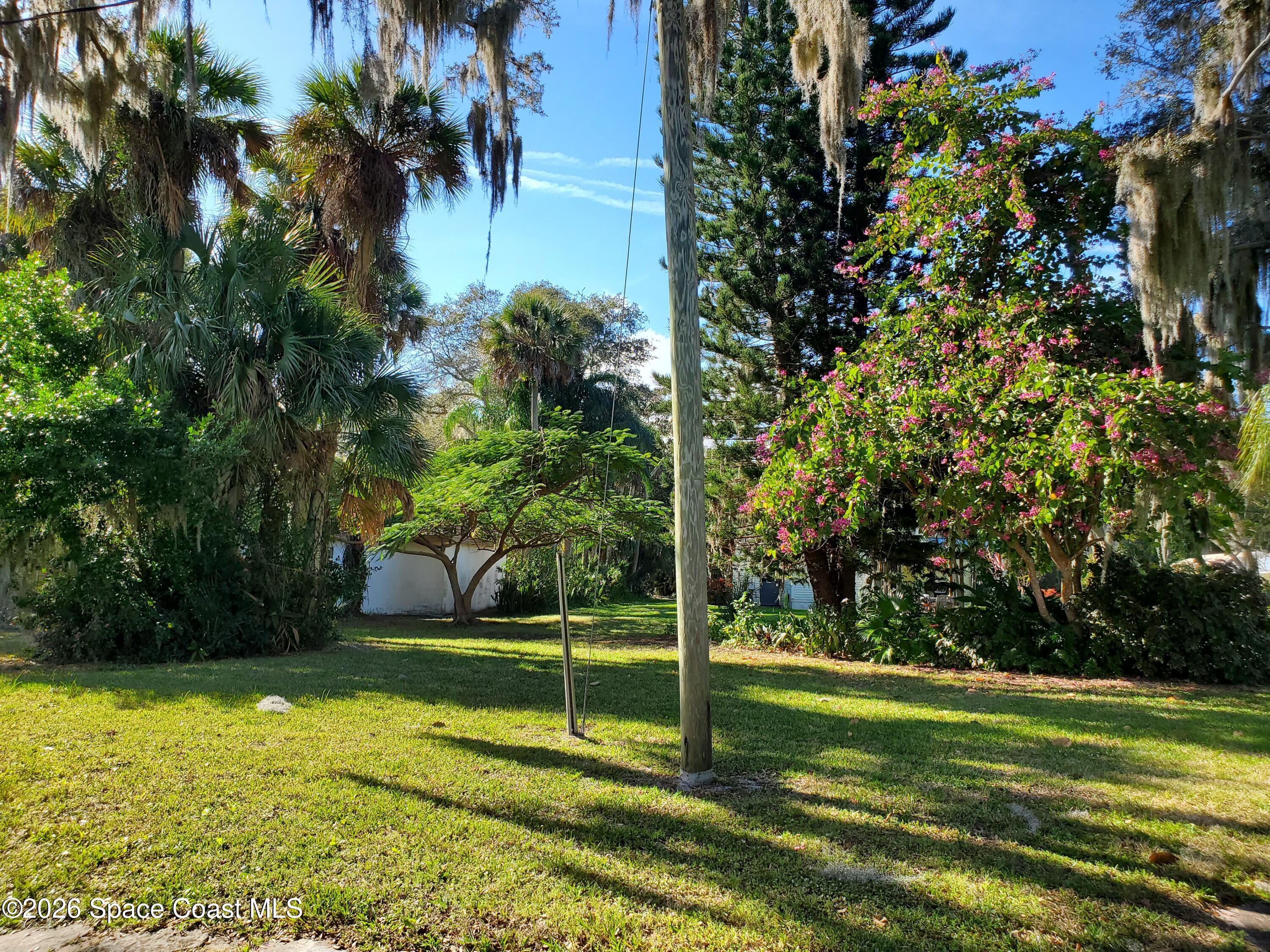 2324 Bignonia Street, Unit 2 Melbourne, FL 32901 - Photo 19 of 19 a view of a backyard with swimming pool