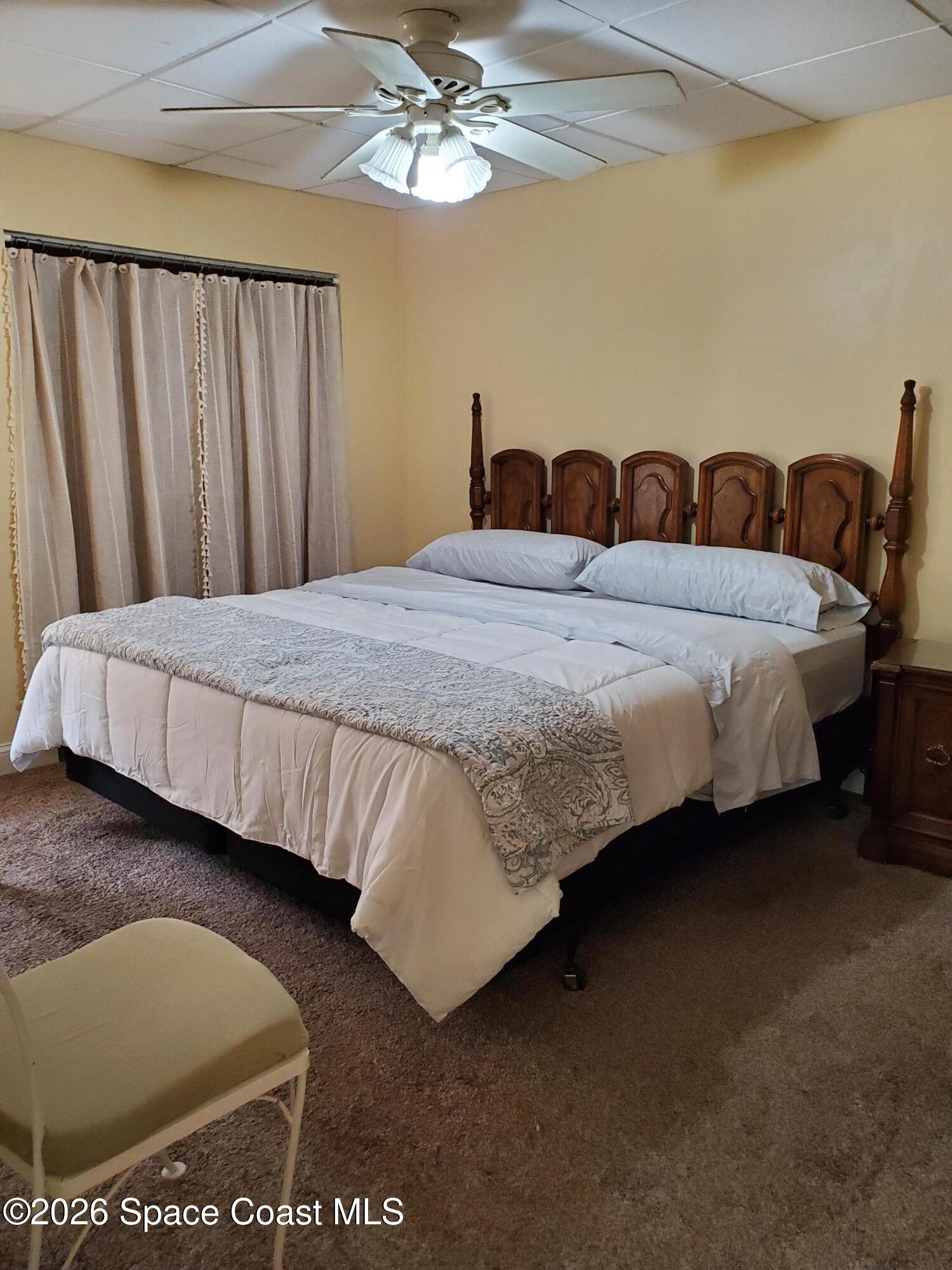 2324 Bignonia Street, Unit 2 Melbourne, FL 32901 - Photo 9 of 19 a bedroom with bed and window