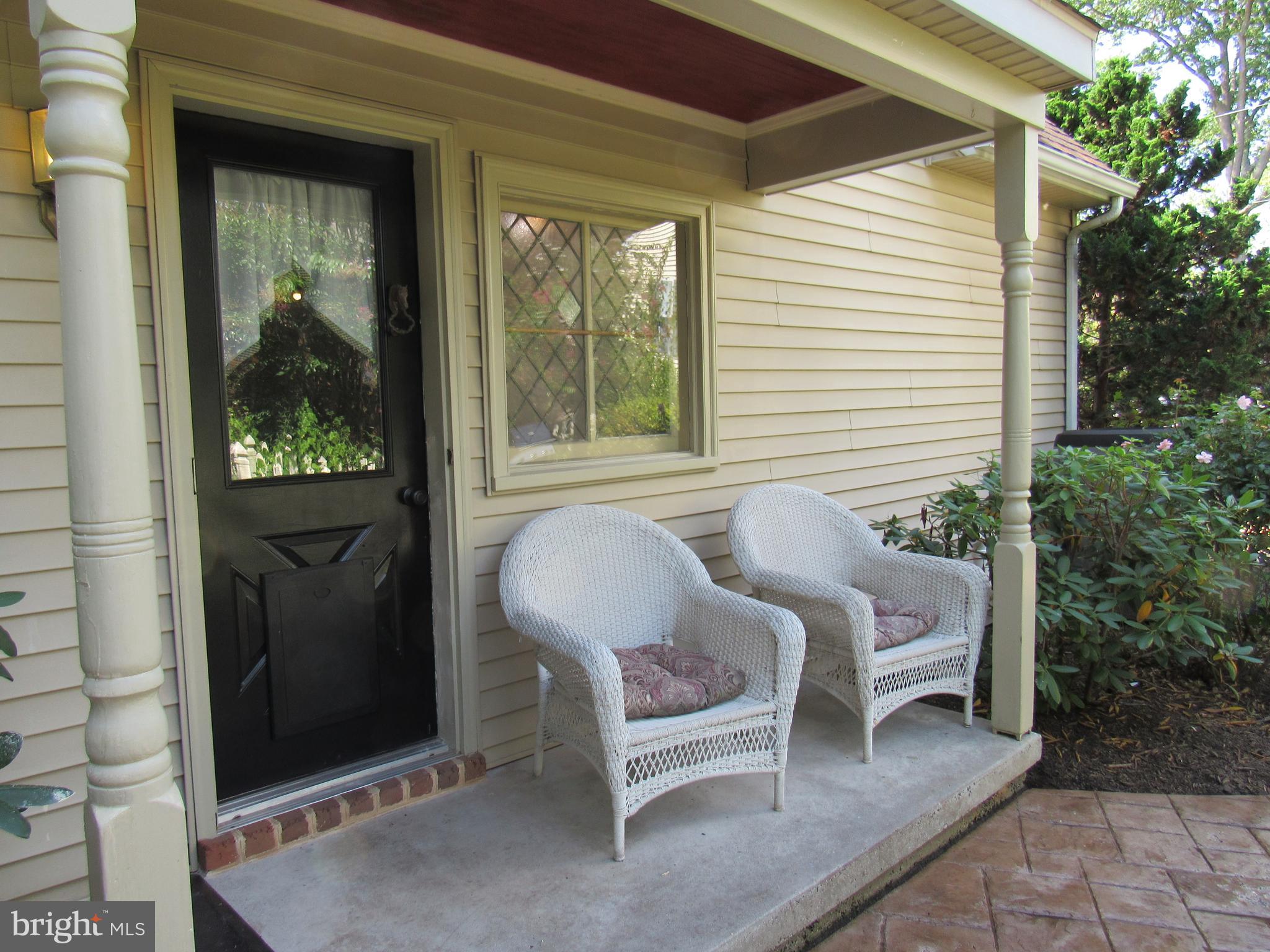 1105 Wilson Street Pottstown, PA 19464 - Photo 11 of 86 a view of a balcony with chairs and a potted plant