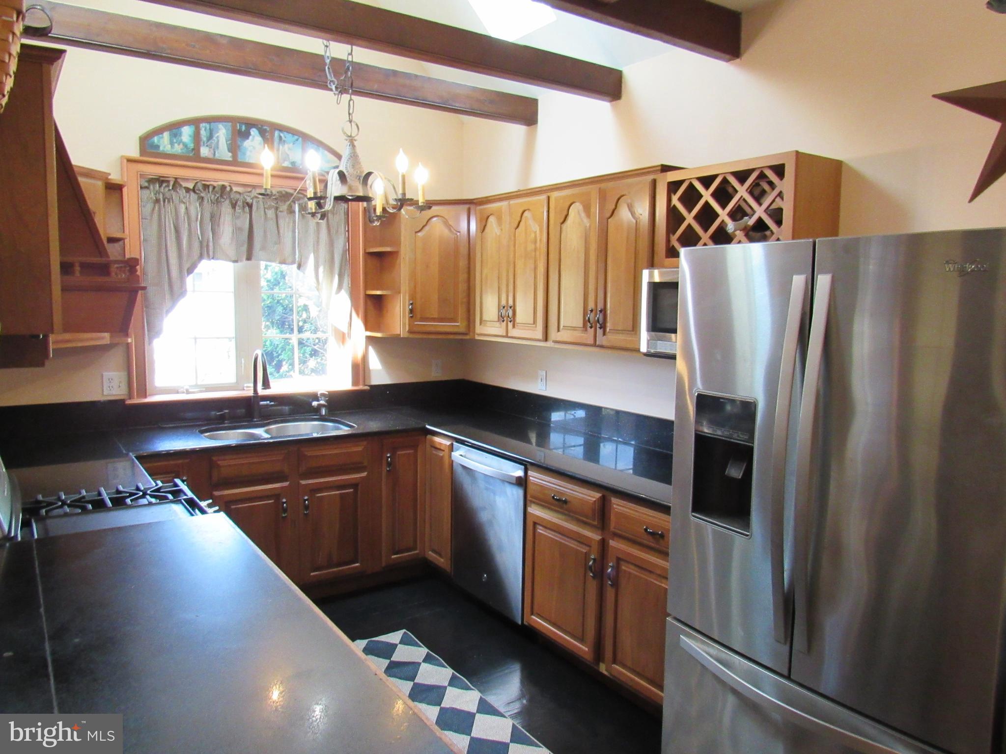 1105 Wilson Street Pottstown, PA 19464 - Photo 22 of 86 a kitchen with stainless steel appliances granite countertop a refrigerator a sink and a stove