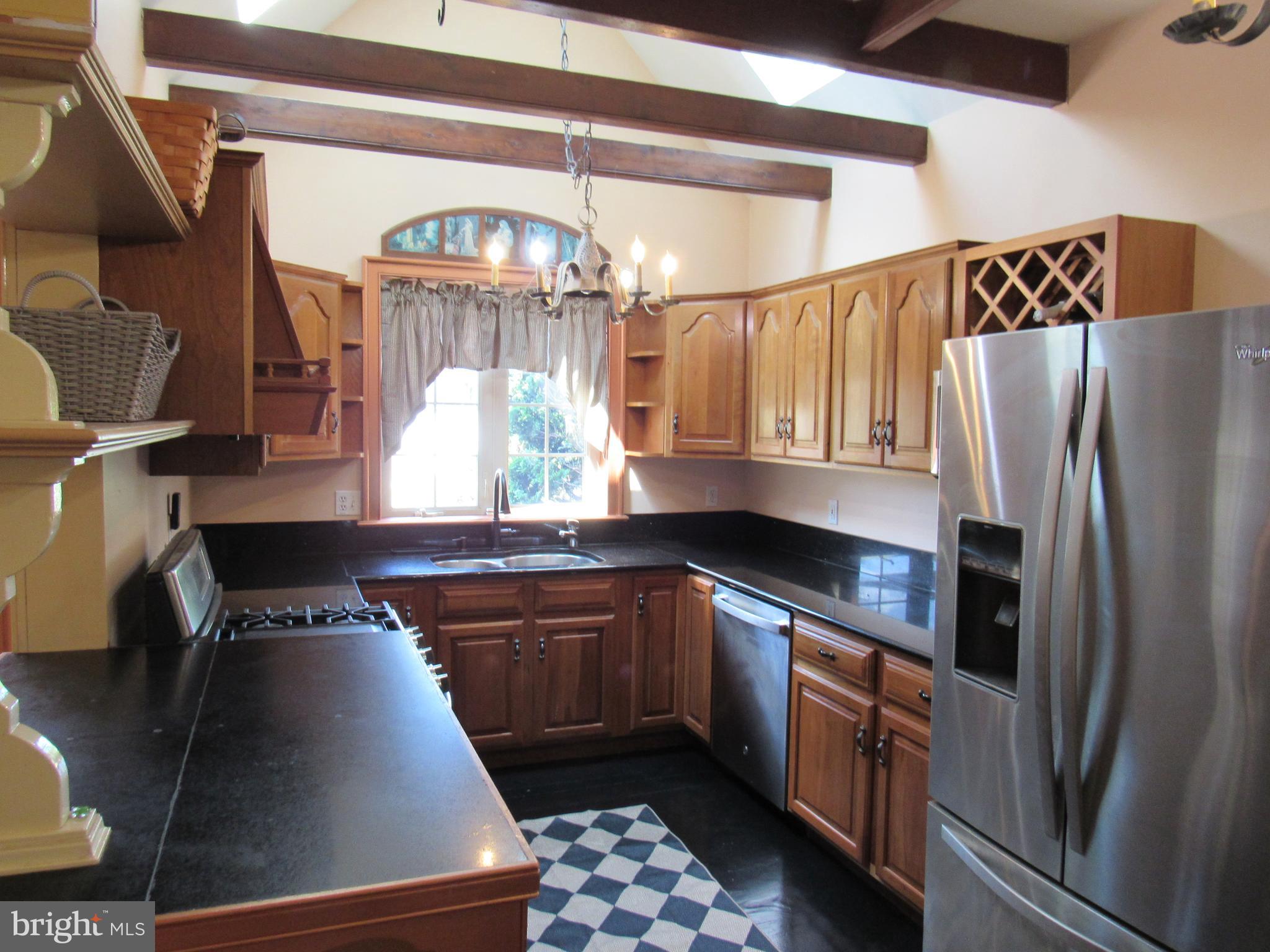 1105 Wilson Street Pottstown, PA 19464 - Photo 24 of 86 a kitchen with stainless steel appliances granite countertop a sink a stove and a refrigerator