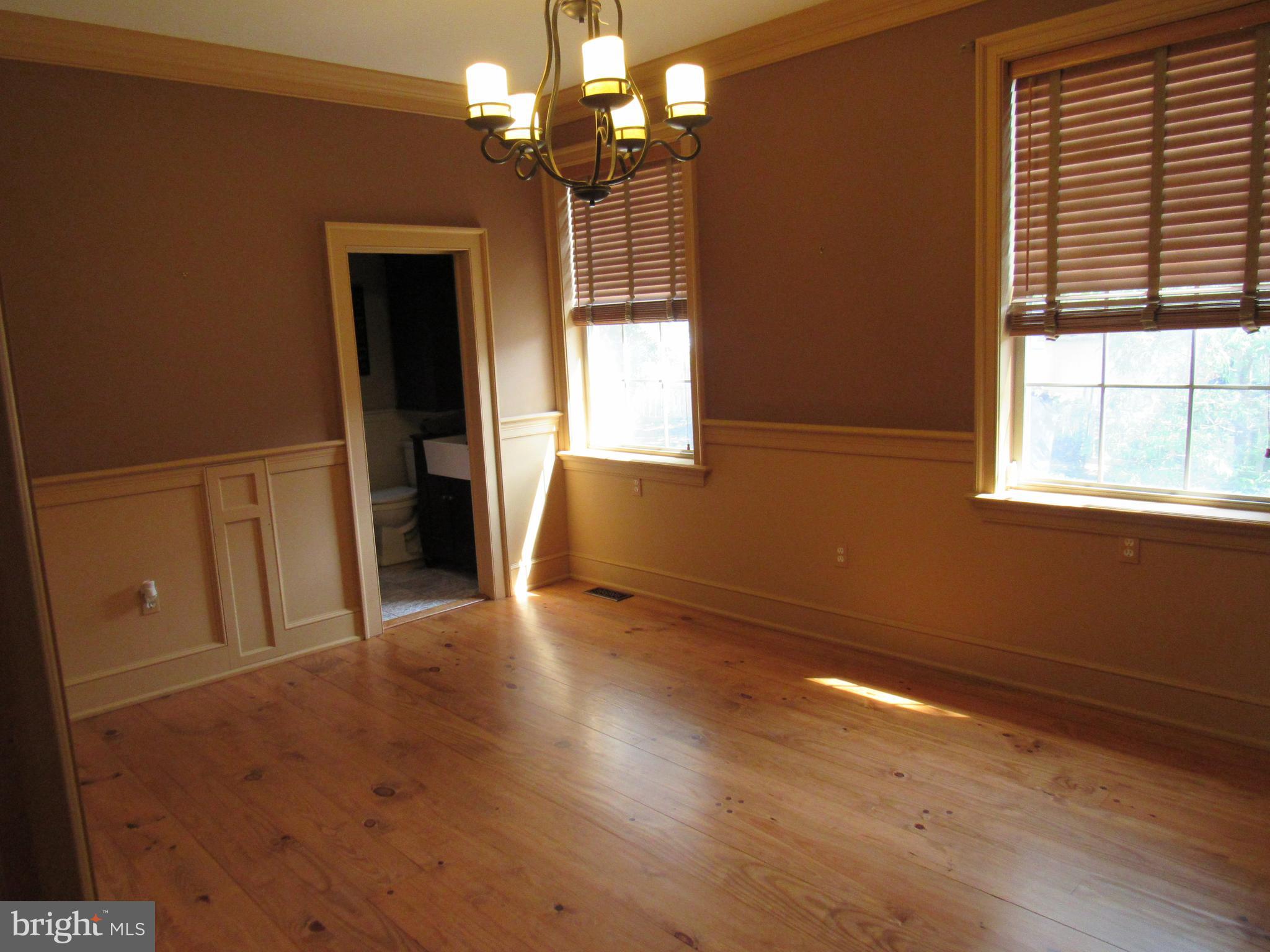 1105 Wilson Street Pottstown, PA 19464 - Photo 32 of 86 an empty room with wooden floor and windows