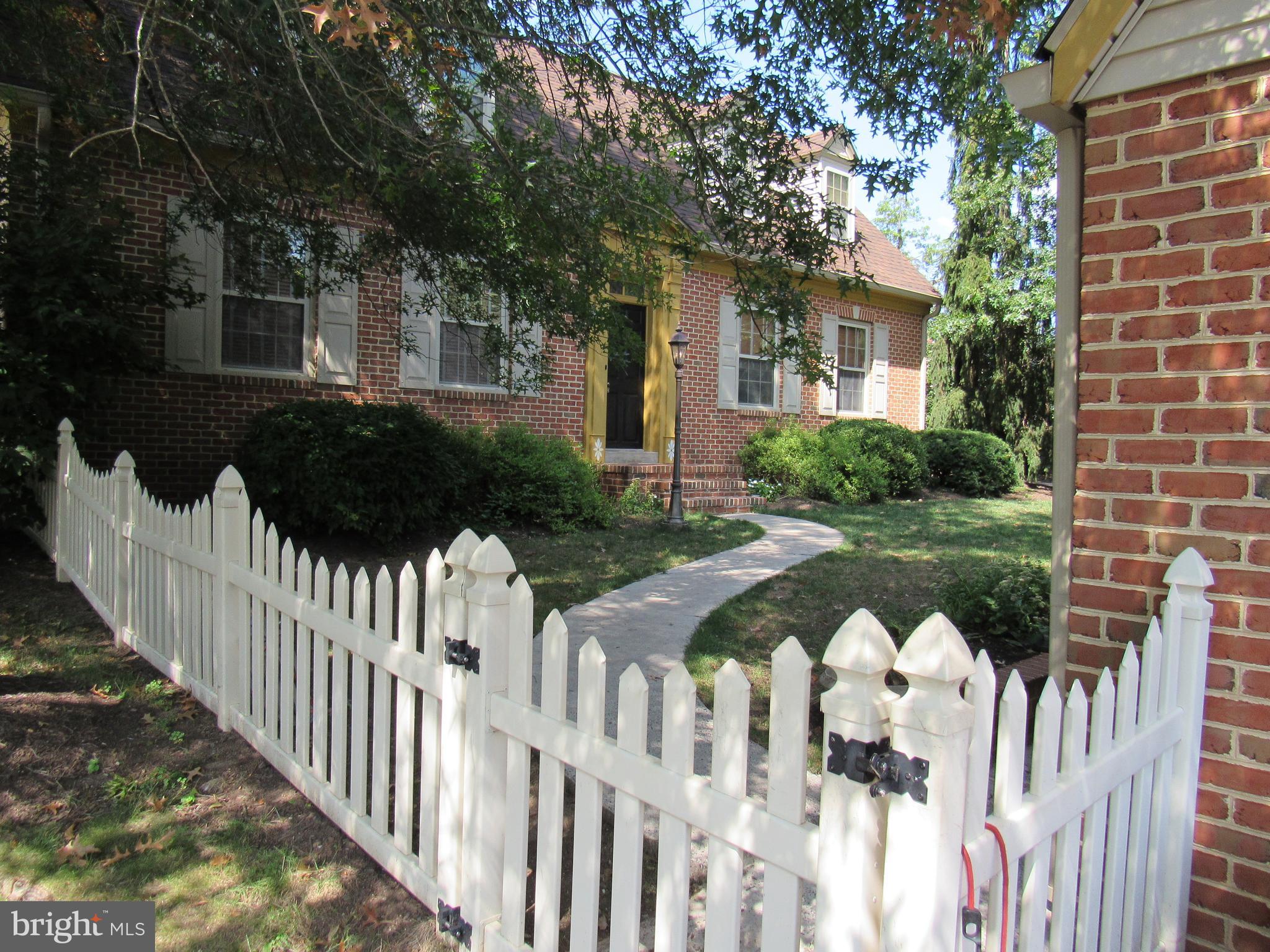 1105 Wilson Street Pottstown, PA 19464 - Photo 6 of 86 a front view of a house with garden