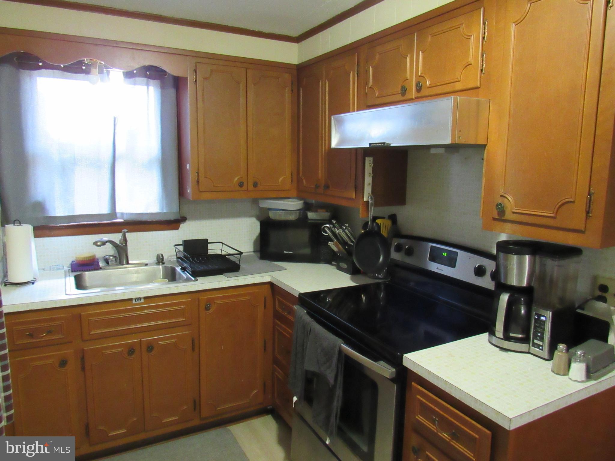 1105 Wilson Street Pottstown, PA 19464 - Photo 70 of 87 a kitchen with a sink cabinets and wooden floor
