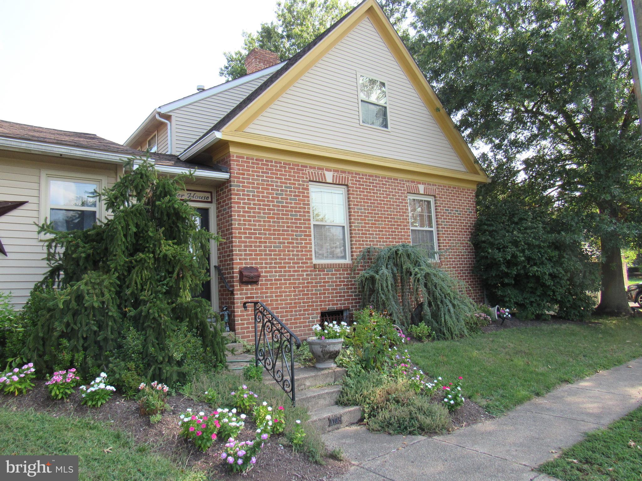 1105 Wilson Street Pottstown, PA 19464 - Photo 8 of 86 a front view of a house with a yard