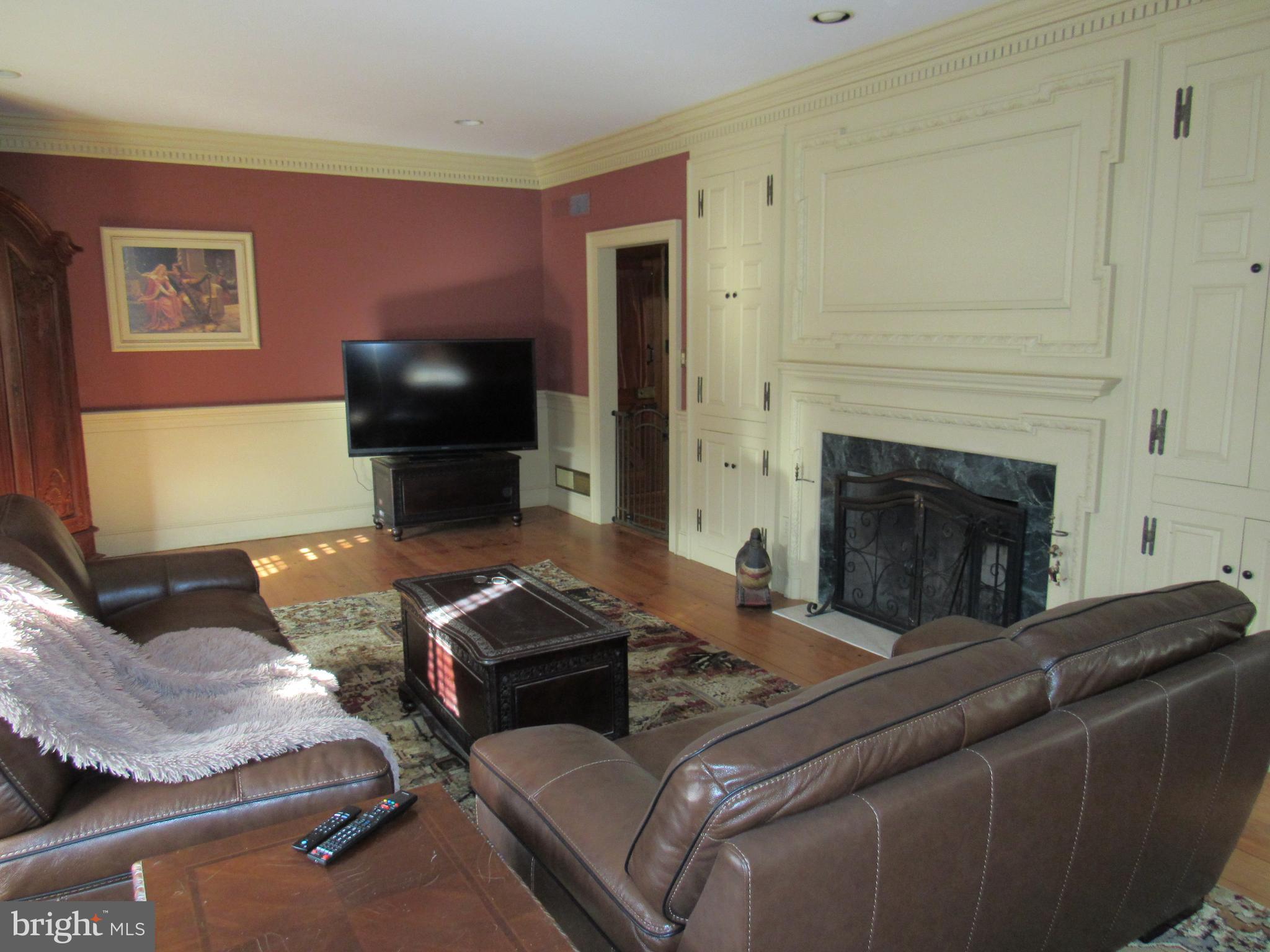 1105 Wilson Street Pottstown, PA 19464 - Photo 84 of 86 a living room with furniture and a flat screen tv