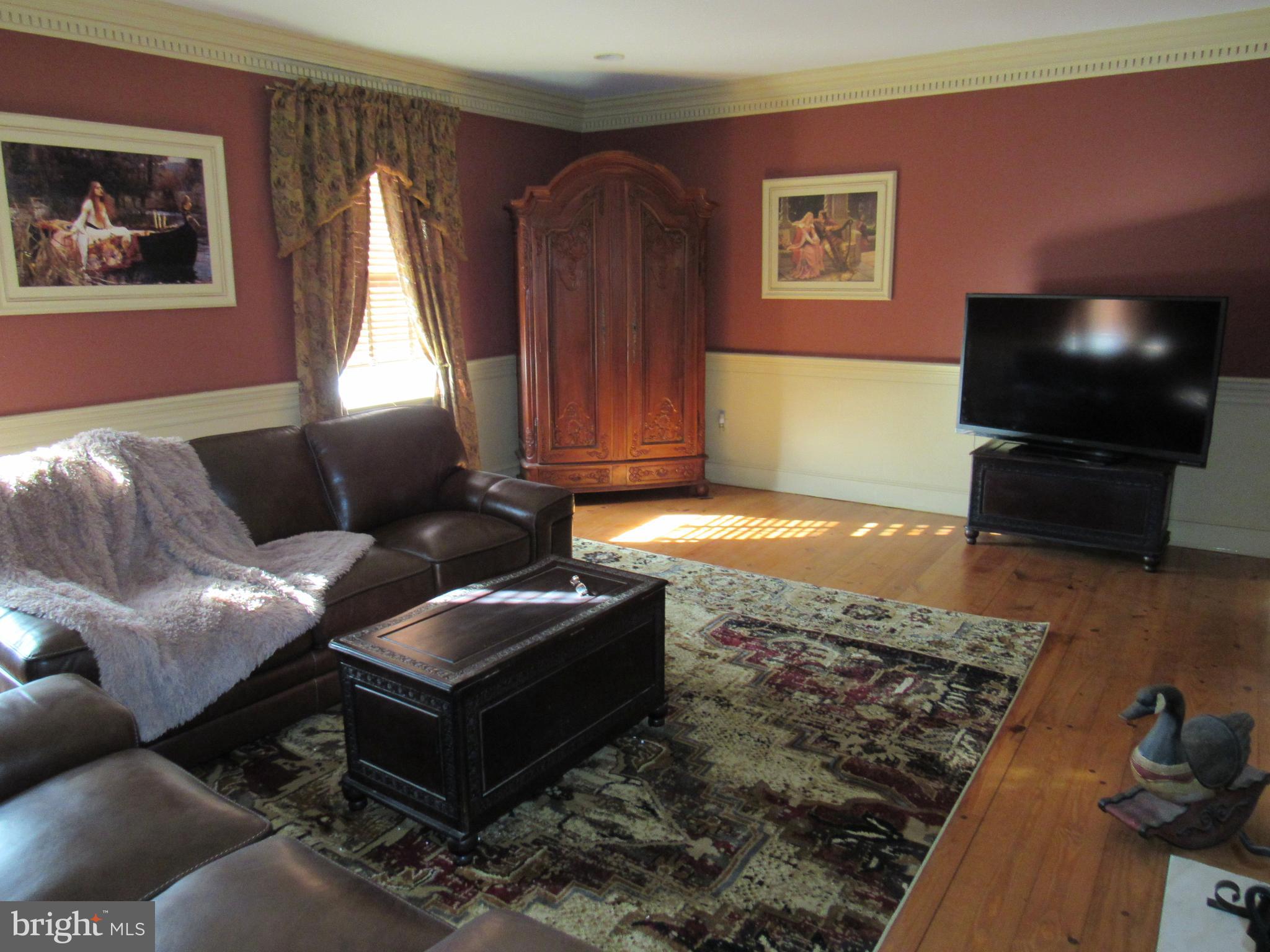 1105 Wilson Street Pottstown, PA 19464 - Photo 87 of 87 a living room with furniture and a flat screen tv