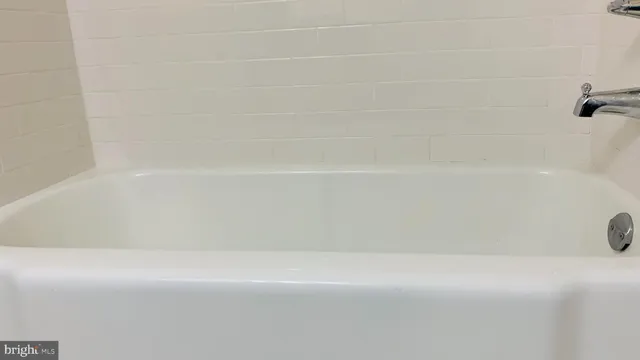 a utility room with cabinets washer and dryer