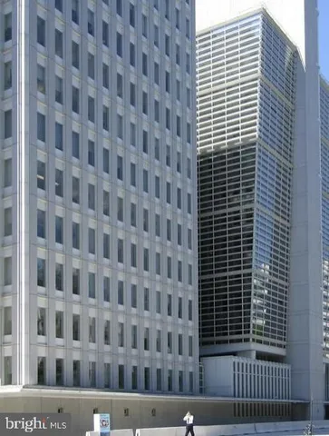 a view of a swimming pool and outdoor seating