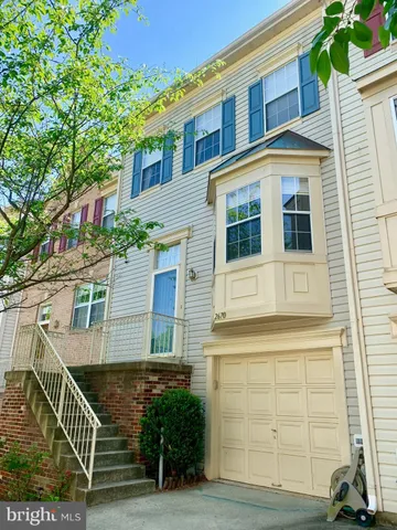 a view of a brick house with many windows