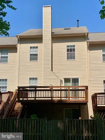 a view of a house with wooden deck