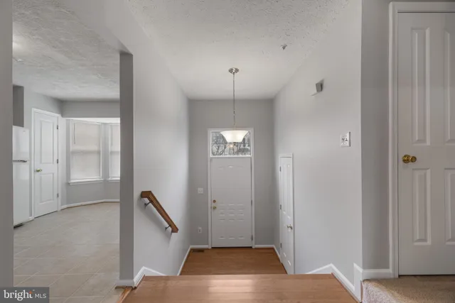 a view of an entryway with front door