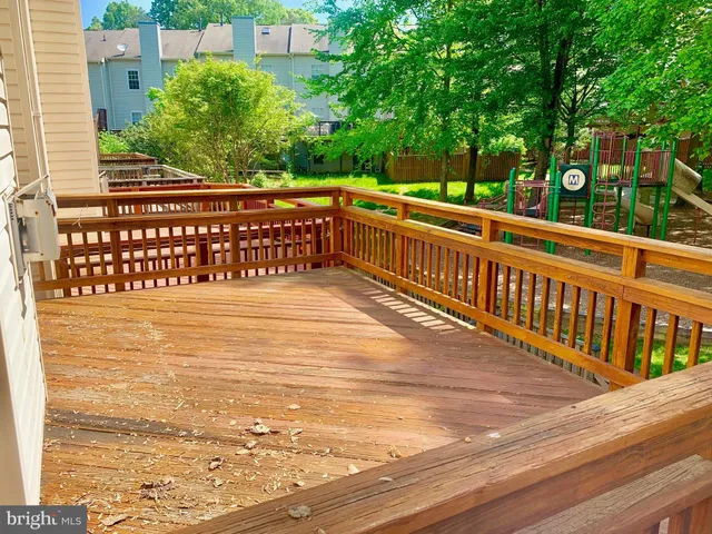 a view of a balcony with wooden floor