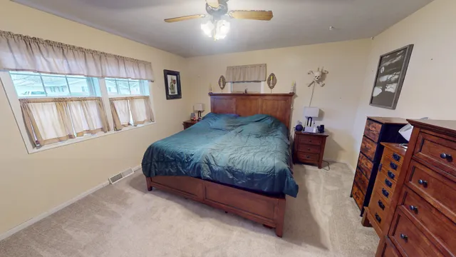 a bedroom with a bed and window