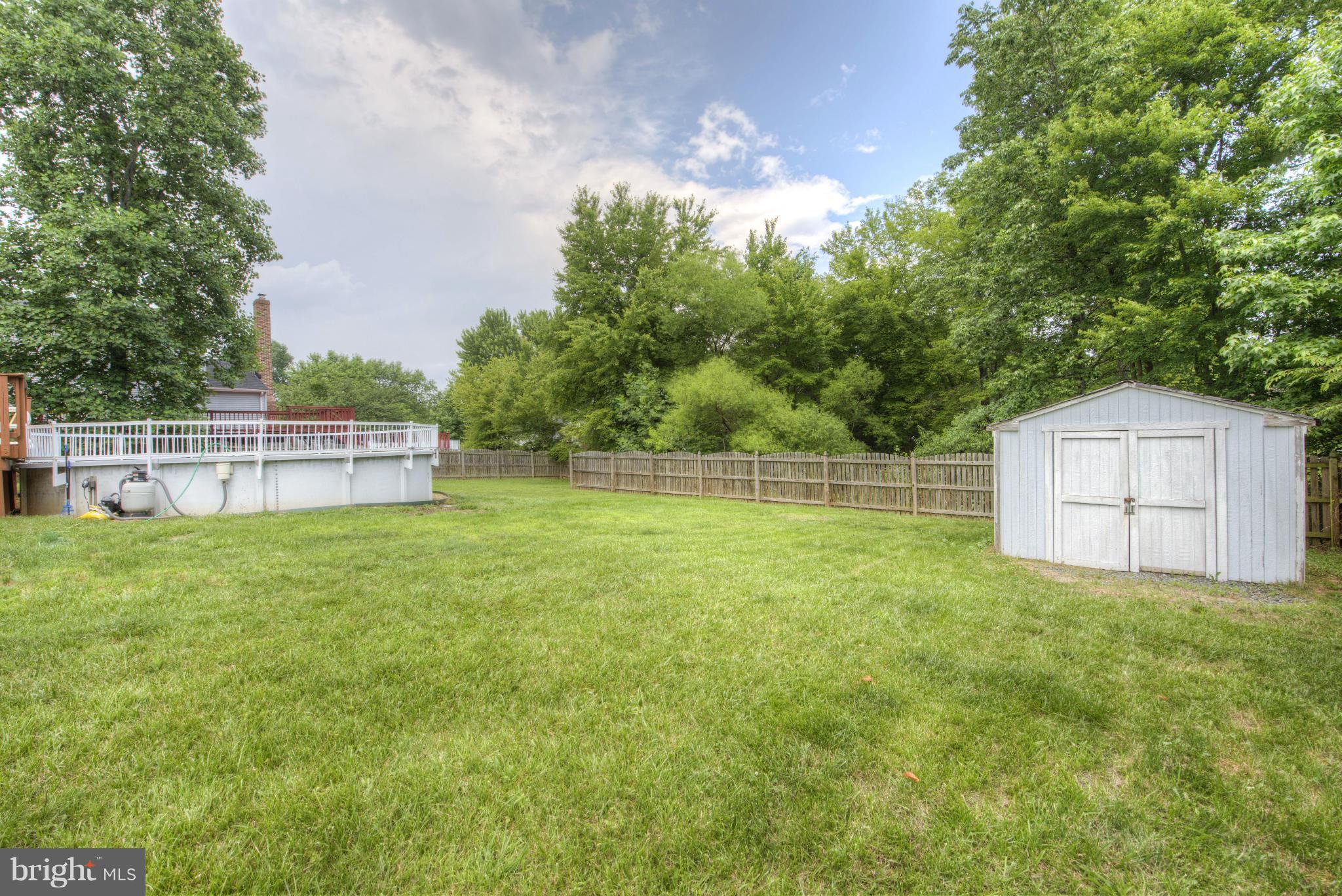 55 Buck Road Stafford, VA 22556 - Photo 18 of 19 a backyard of a house with lots of green space