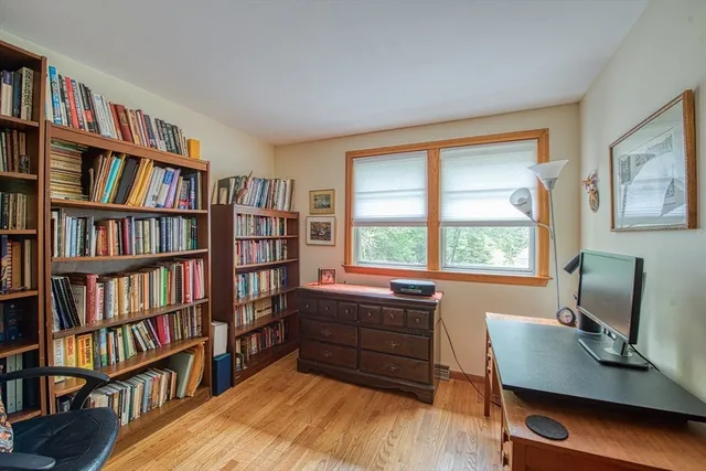 a room with furniture window and a book shelf