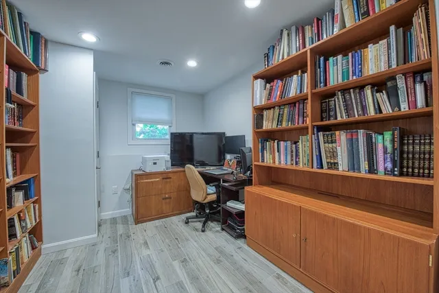 a view of a workspace with bookshelf