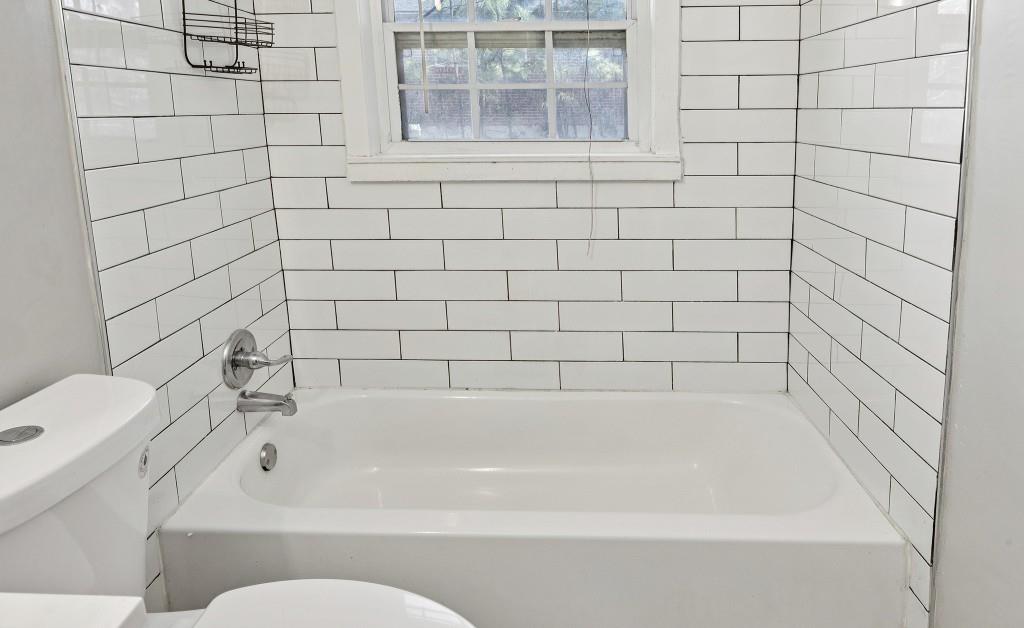 61 Pine Street Northeast Fairburn, GA 30213 - Photo 12 of 22 a bathroom with a bathtub