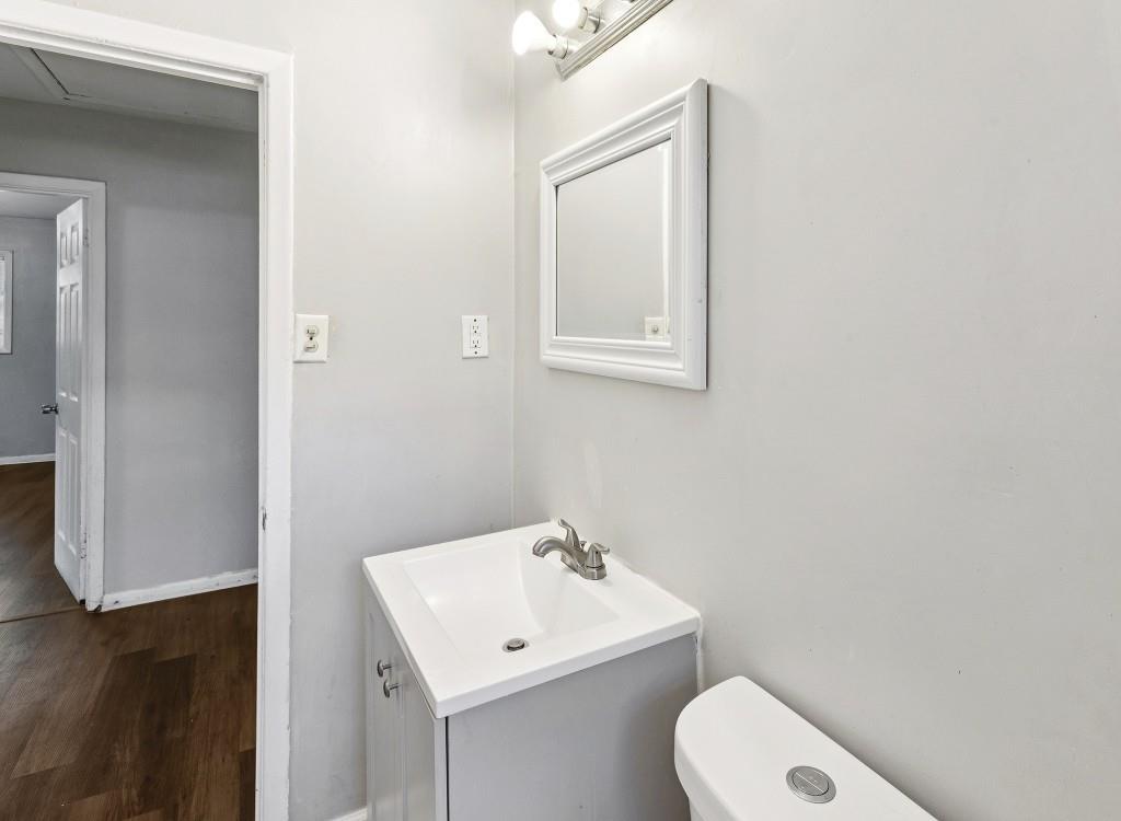 61 Pine Street Northeast Fairburn, GA 30213 - Photo 13 of 22 a bathroom with a toilet sink and mirror