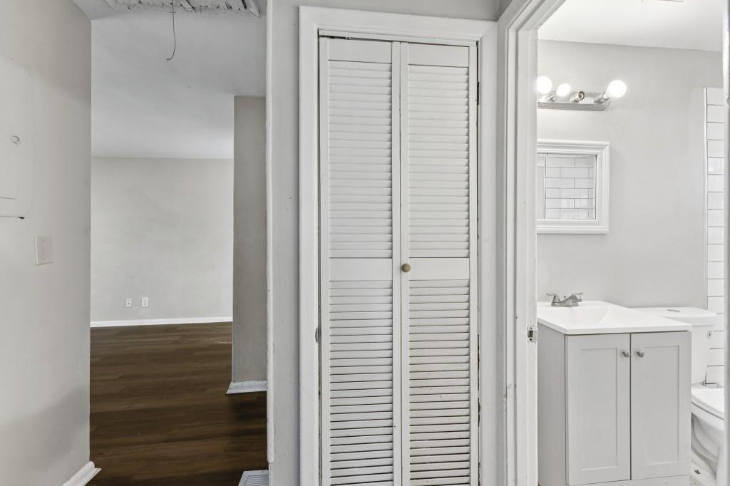 61 Pine Street Northeast Fairburn, GA 30213 - Photo 14 of 22 a bathroom with a sink and a mirror