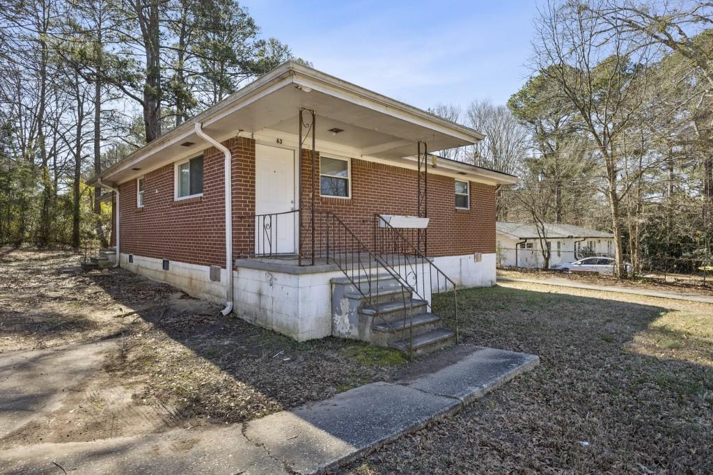 61 Pine Street Northeast Fairburn, GA 30213 - Photo 3 of 22 a front view of a house with a yard