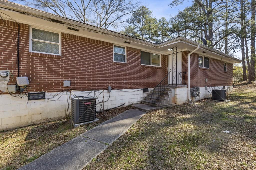 61 Pine Street Northeast Fairburn, GA 30213 - Photo 4 of 22 a front view of a house with garden