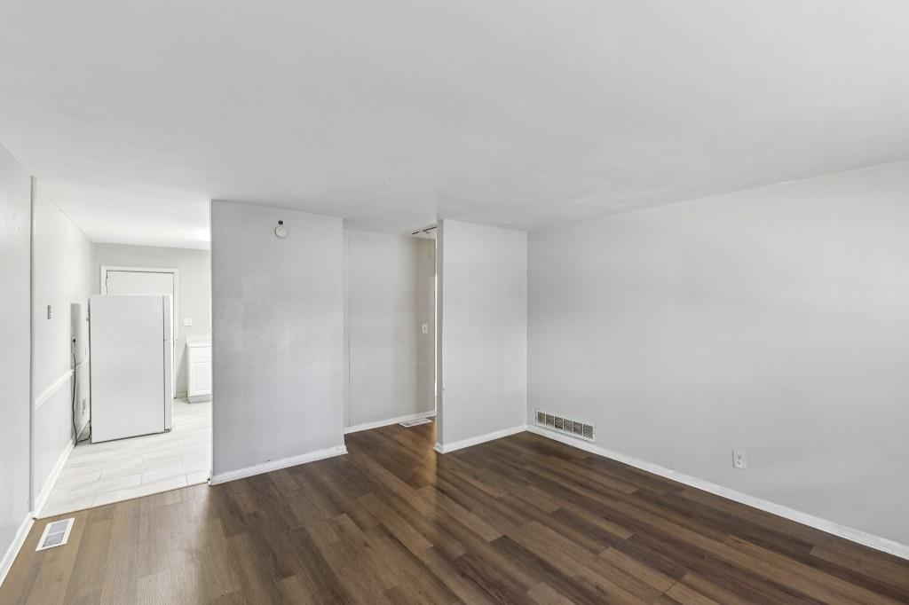 61 Pine Street Northeast Fairburn, GA 30213 - Photo 5 of 22 a view of wooden floor and windows in a room