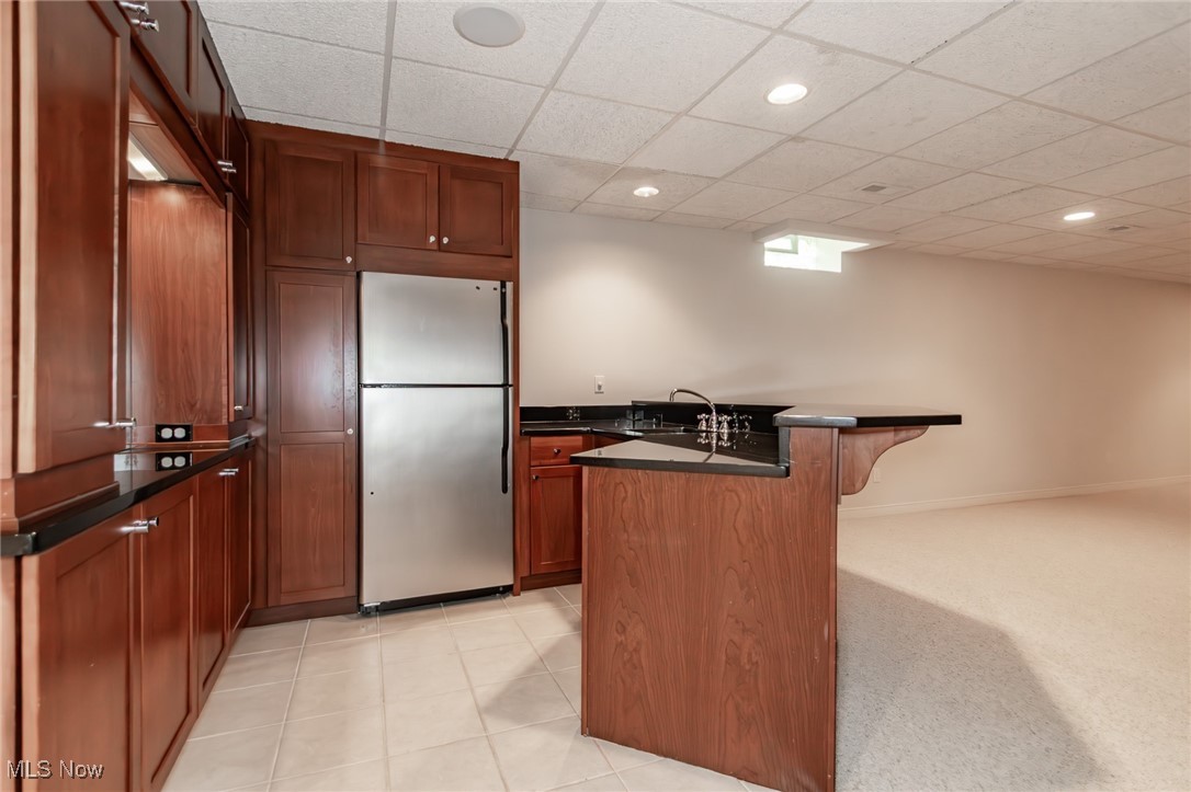 293 Burwick Road Cleveland, OH 44143 - Photo 35 of 50 The finished lower level features a gorgeous wet bar with granite counters, full size stainless steel refrigerator and a wine cooler!