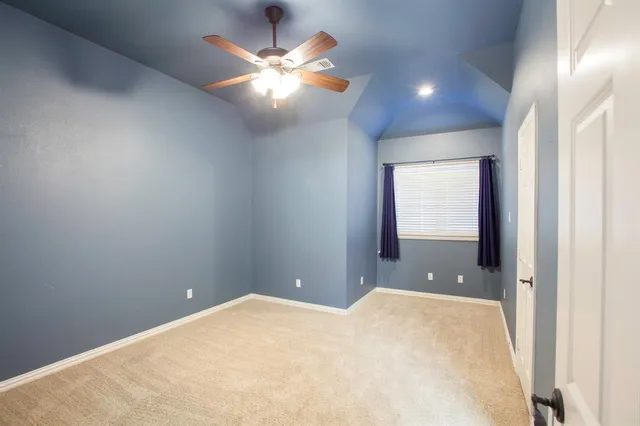 an empty room with a bathroom