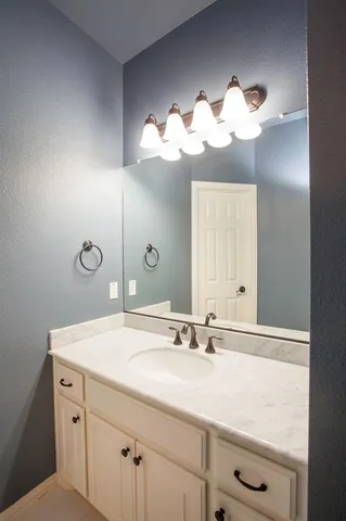 a view of a chandelier fan in a room