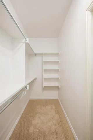 a kitchen with stainless steel appliances granite countertop a refrigerator and a stove