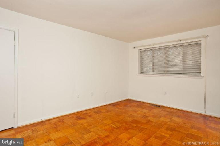 17 Hamill Road, Unit A Baltimore, MD 21210 - Photo 14 of 21 a view of empty room with wooden floor
