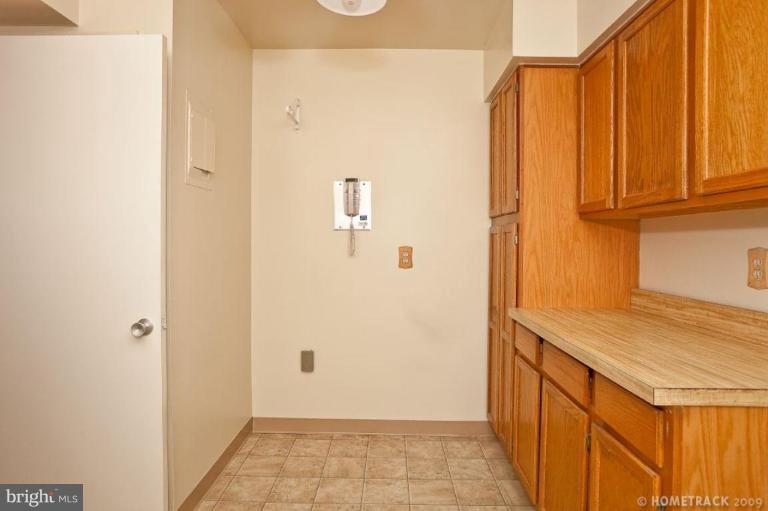17 Hamill Road, Unit A Baltimore, MD 21210 - Photo 7 of 21 a bathroom with a granite countertop sink and a mirror