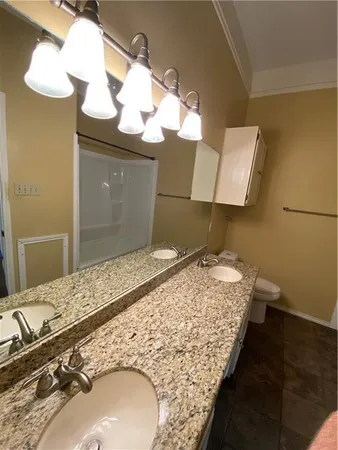 a bathroom with a shower and a bath tub